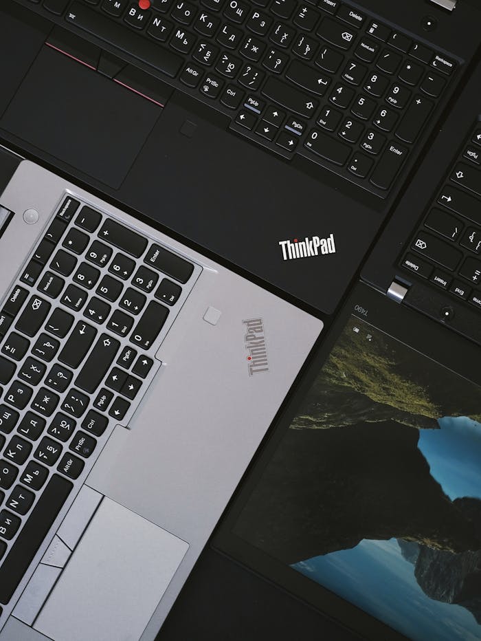 Close-up of modern ThinkPad laptops showcasing sleek design and technology.
